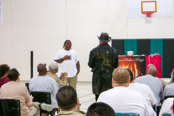 Magician performing with a volunteer
