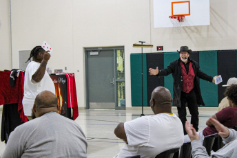 Magician performing with a volunteer