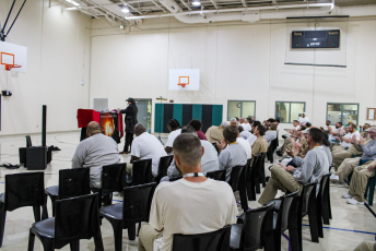 Magician performs in front of a group of people