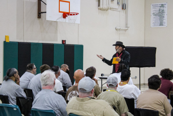 Magician performs in front of a group of people