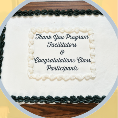 Photo of a cake celebrating program completions and facilitators
