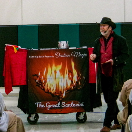 Magician speaks to a group of people